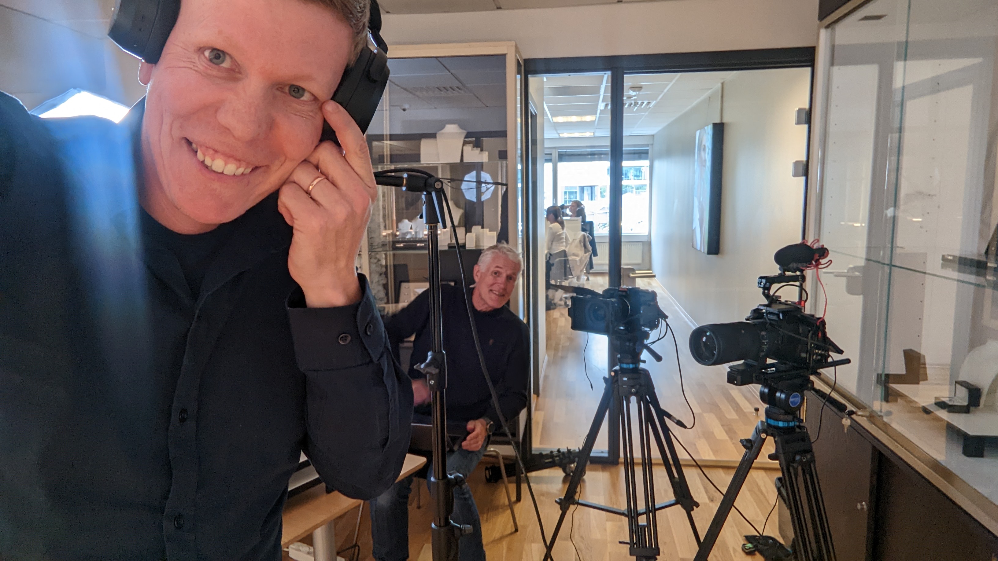 Roy-André on set with professional filming equipment